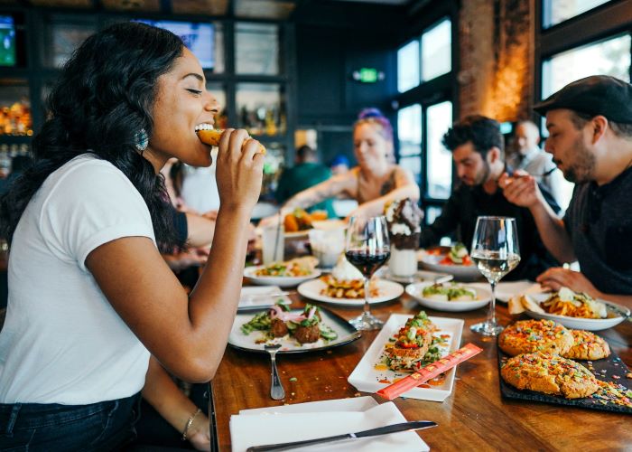 Group of friends enjoying a meal in a restaurant together